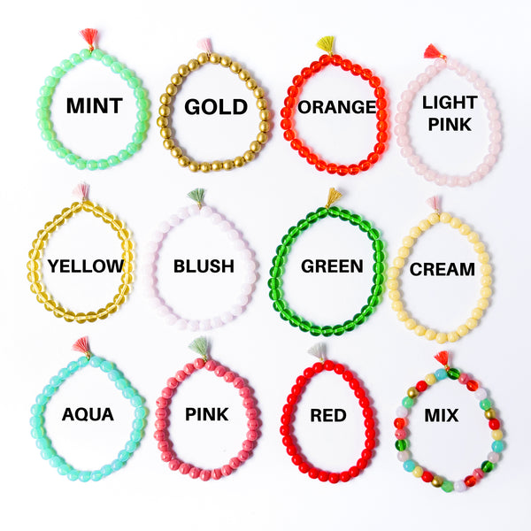 Build your own set of three Smooth Glass Bead Stretch Bracelets with Tassel