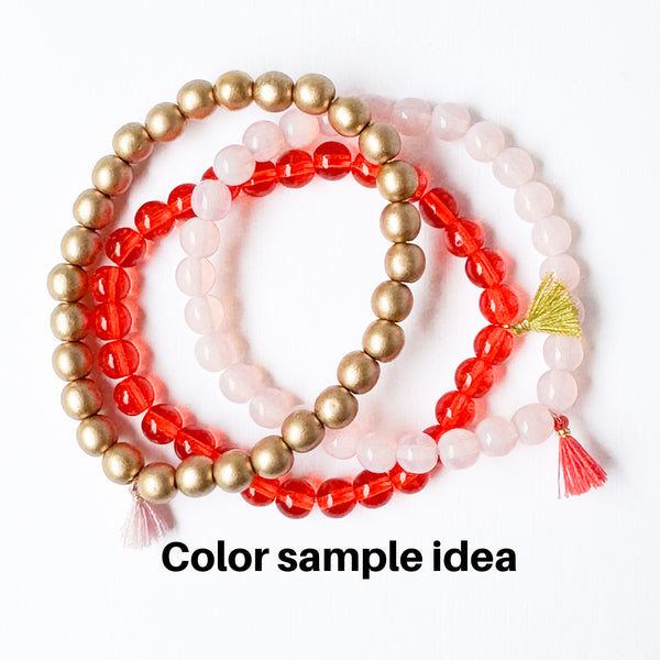 Build your own set of three Smooth Glass Bead Stretch Bracelets with Tassel