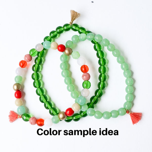 Build your own set of three Smooth Glass Bead Stretch Bracelets with Tassel
