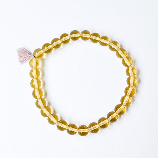 Build your own set of three Smooth Glass Bead Stretch Bracelets with Tassel