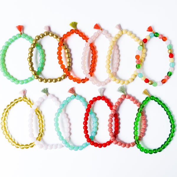 Build your own set of three Smooth Glass Bead Stretch Bracelets with Tassel
