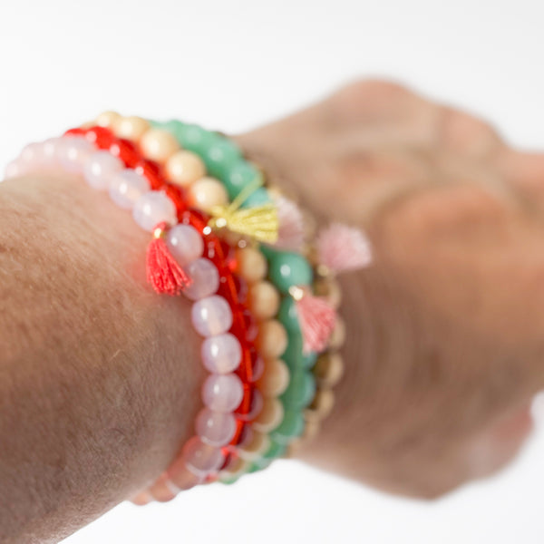 Build your own set of three Smooth Glass Bead Stretch Bracelets with Tassel